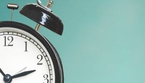 an old alarm clock showing 2:50.