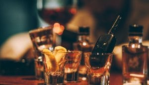 A bar table filled with empty drink and lost car keys