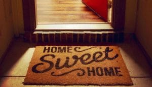 A open door at night leaking light on a 