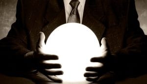 business man holding a crystal ball