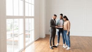 realtor showing a client a house