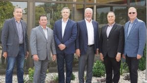 Employeess from Progressive Meats Inc. and Johnsonville, LLC at deal signing